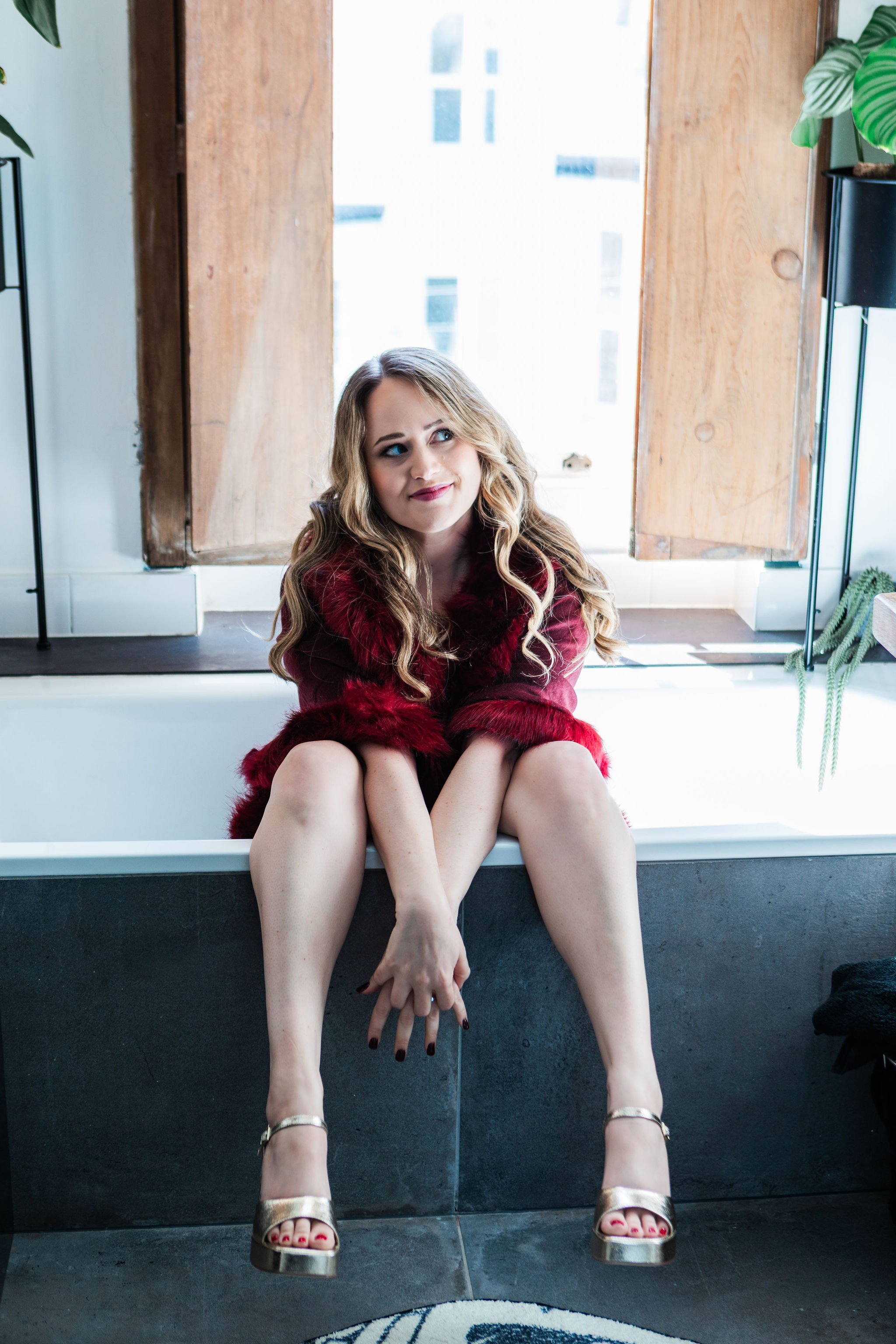 Chantelle in a red faux-fur jacket